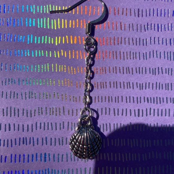 Long dangling earrings in a sea shell shape. - Picture 3 of 7